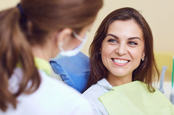 woman smiling after receiving dental care lincoln illinois and morton illinois
